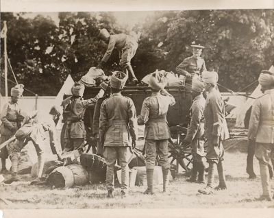 India soldiers unload a wagon. The caption on the back refers to the soldiers helping the Allies by 'unloading their baggage,' but Indian soldiers fought on their own.
Reverse:
India's army which is helping the allies unloading their baggage. (C) American Press Association
SEP 14 1914