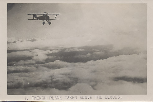 A French Nieuport fighter plane in flight, possibly a Nieuport 17, but possibly another model up to the Nieuport 27, with machine guns both above the upper wing, and along the fuselage.
The V struts, machine gun mounted above the upper wing, circular cowling, upward sweep of the tail, the tail itself, all mark the plane as a Nieuport.
Text:
1. French plane taken above the clouds.
Original 5x7 Aerial Photo. Reverse: blank.