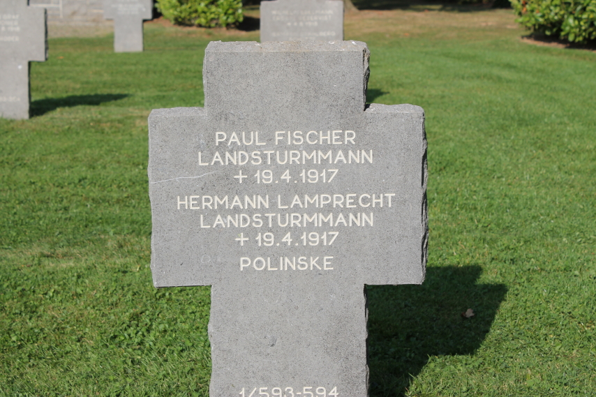 Headstone in the German Cemetery at Cerny-en-Laonnois for the graves of the Landsturm infantrymen Paul Fischer and Hermann Lamprecht, both died April 19, 1917 during the Second Battle of the Aisne. The grave contains the remains of 'Polinske', dead with no further information. The %i1%Landsturm%i0% were reserve units, typically of older men.
Text:
Paul Fischer Landsturmmann +19.4.1917
Hermann Lamprecht Landsturmmann +19.4.1917
Polinske