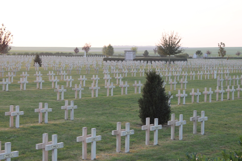 Headstones at La Nécropole Nationale de Pontavert. The cemetery contains the remains of 6,815 soldiers, 67 of them British, 54 Russian, and the remainder French. Of the total, 1,364 are entombed in the ossuary.